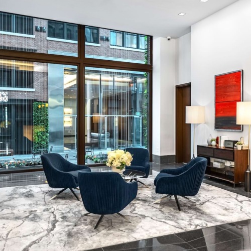 Comfortable lobby seating area offering residents and guests a relaxed place to pause and gather.