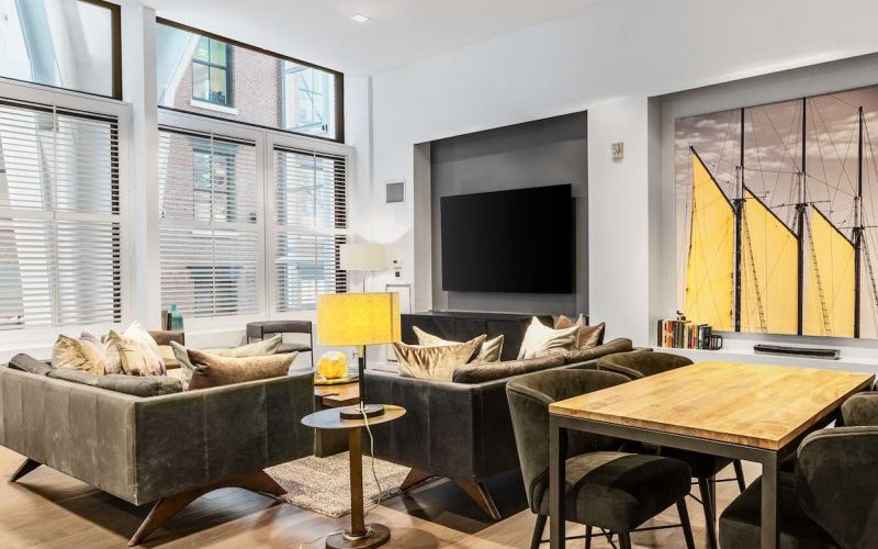 Communal table in the resident lounge, offering a flexible setting for working, dining, or socializing.
